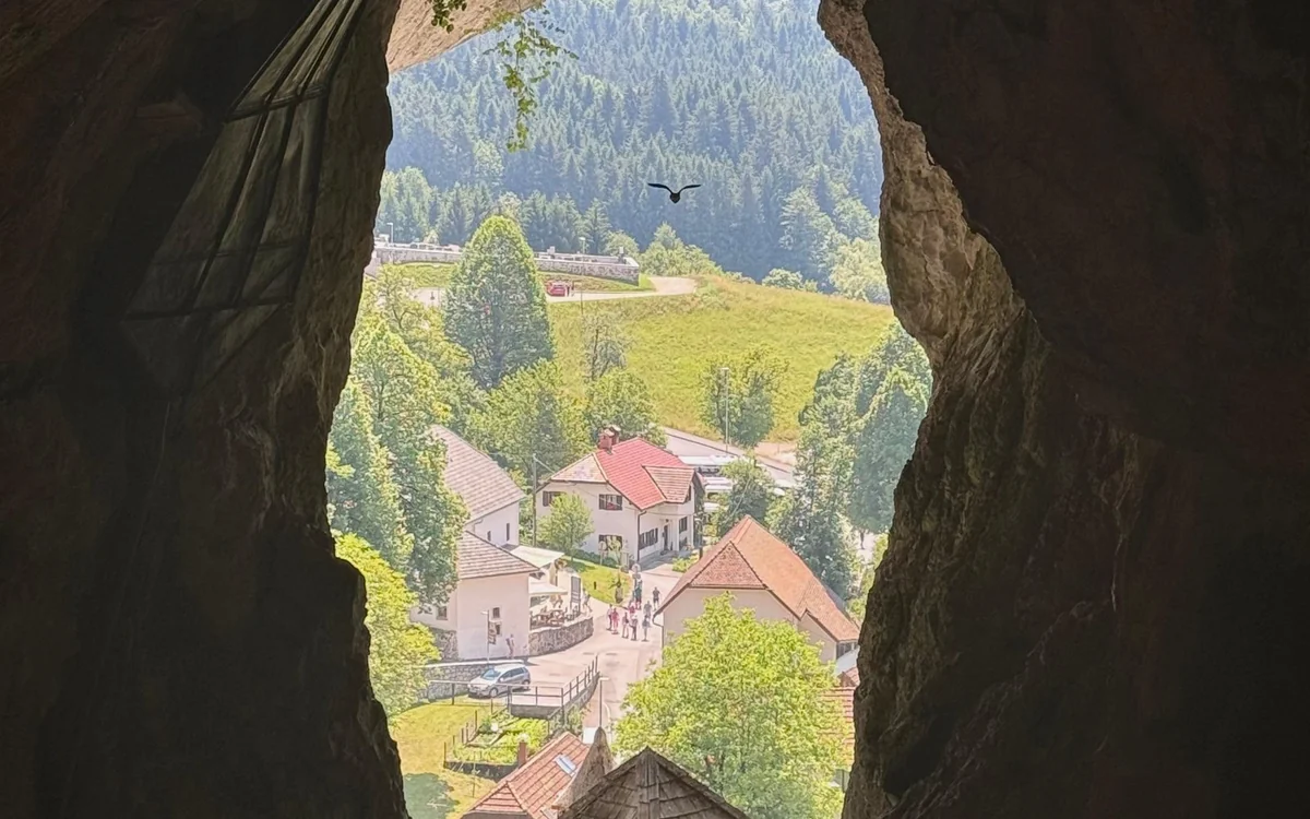 The entrance building at Postojna Cave with visitors arriving independently